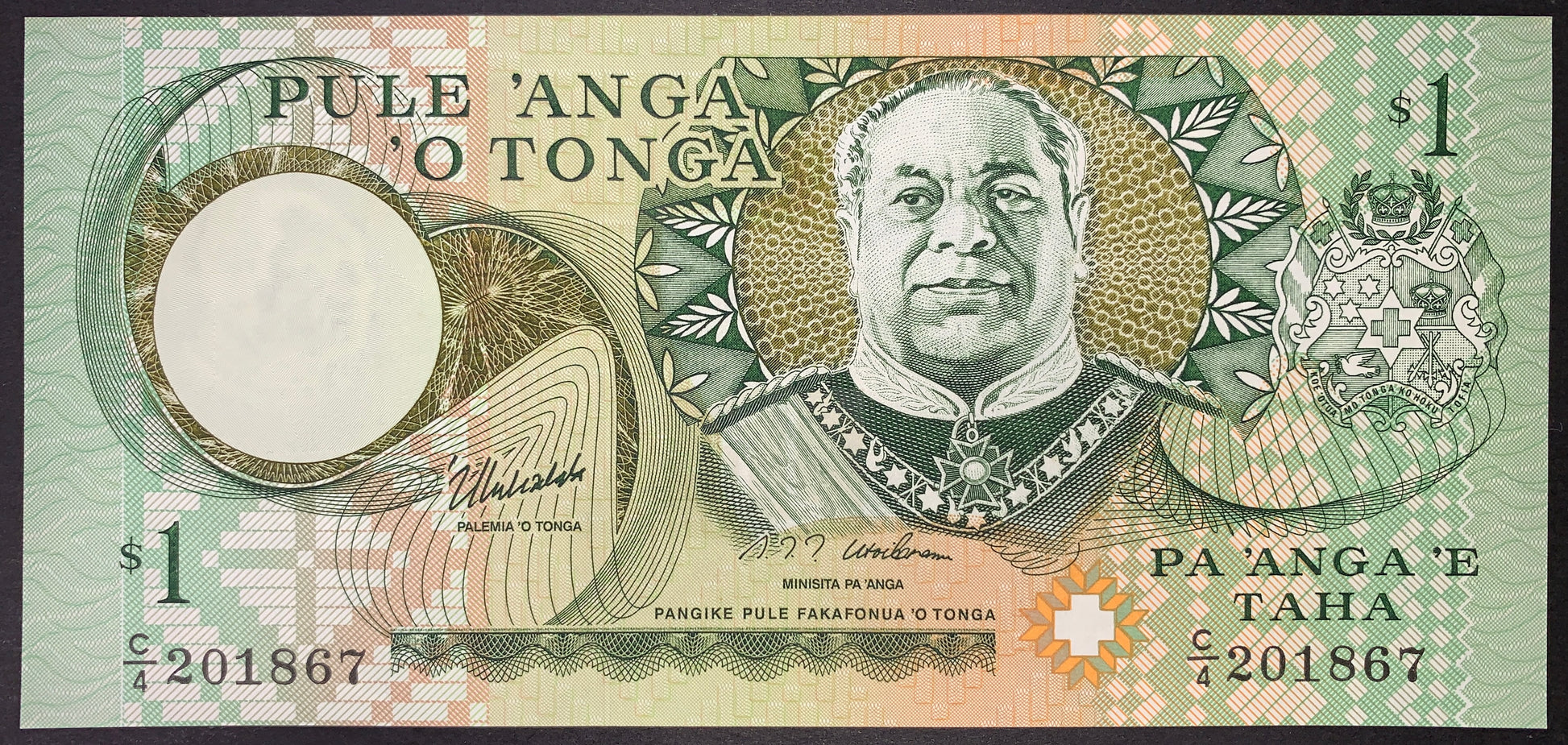Obverse view of a green and multicolored Tonga 1 Pa'anga banknote in crisp uncirculated condition. The central-right section displays a portrait of King Tāufaʻāhau Tupou IV in military uniform. The national Coat of Arms is featured on the far right, and a large circular watermark window is located on the left. The black serial number C/4 201867 is printed on both the lower-left and lower-right, surrounded by intricate Polynesian-inspired patterns.