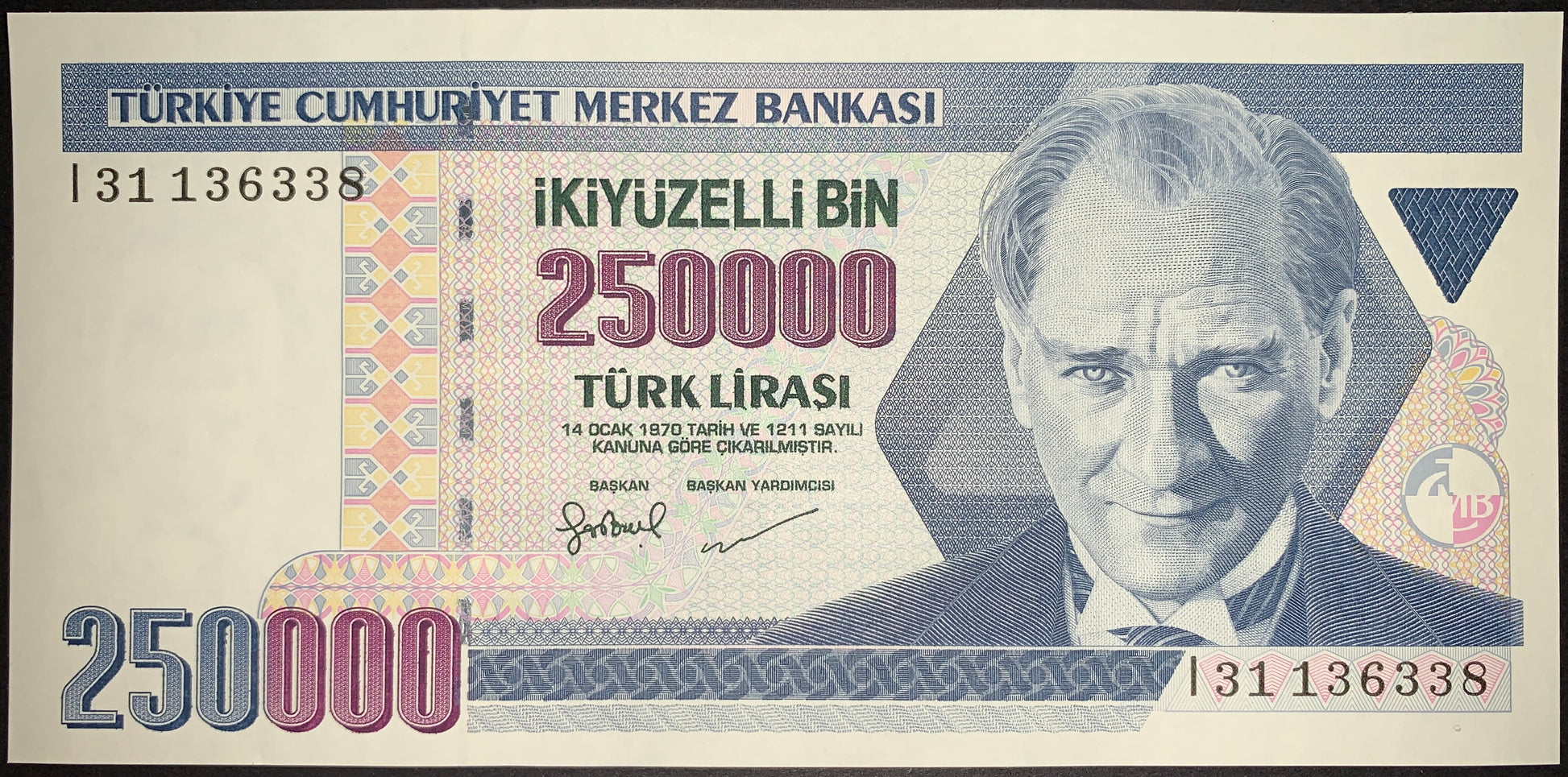 front of  collectible banknote with portrait of Mustafa Kemal Atatürk