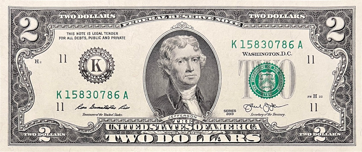 Front view of an uncirculated Series 2013 United States 2 Dollar bill featuring Thomas Jefferson and the Federal Reserve Bank of Dallas seal.