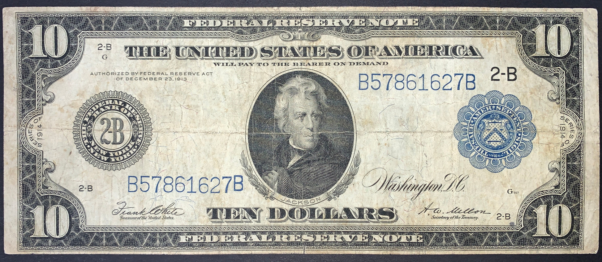 front of US 10 Dollars Federal Reserve Note 1914 P-360b F+ collectible vintage banknote with portrait of Andrew Jackson and blue treasury seal