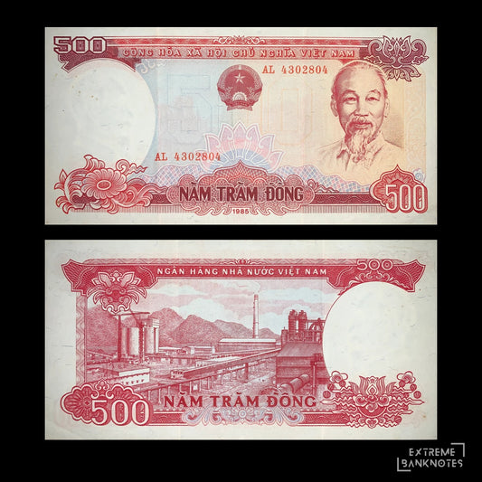 Obverse and reverse of an authentic Vietnam 500 Đồng banknote 1985 P-99 featuring a portrait of Ho Chi Minh on the front and an industrial factory complex on the reverse.
