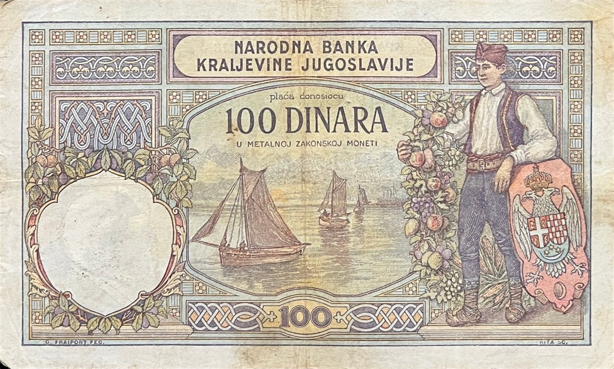 Back view of a 1929 Yugoslavia 100 Dinara banknote showing a young man in Serbian national dress with the royal Yugoslav coat of arms and sailing boats.