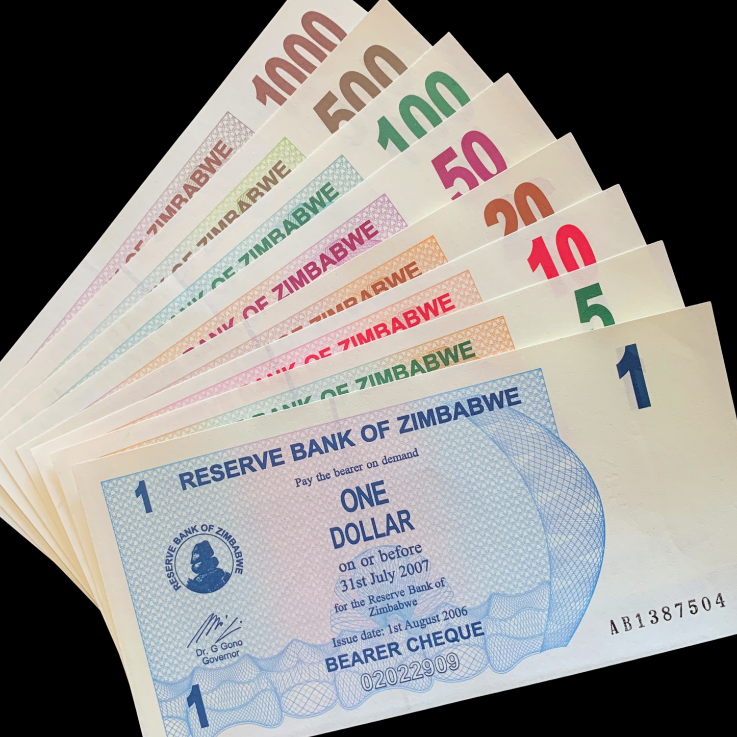 Zimbabwean dollar banknotes from 1 to 1000 dollars on a blackbackground UNC Bearers Cheque Bundle
