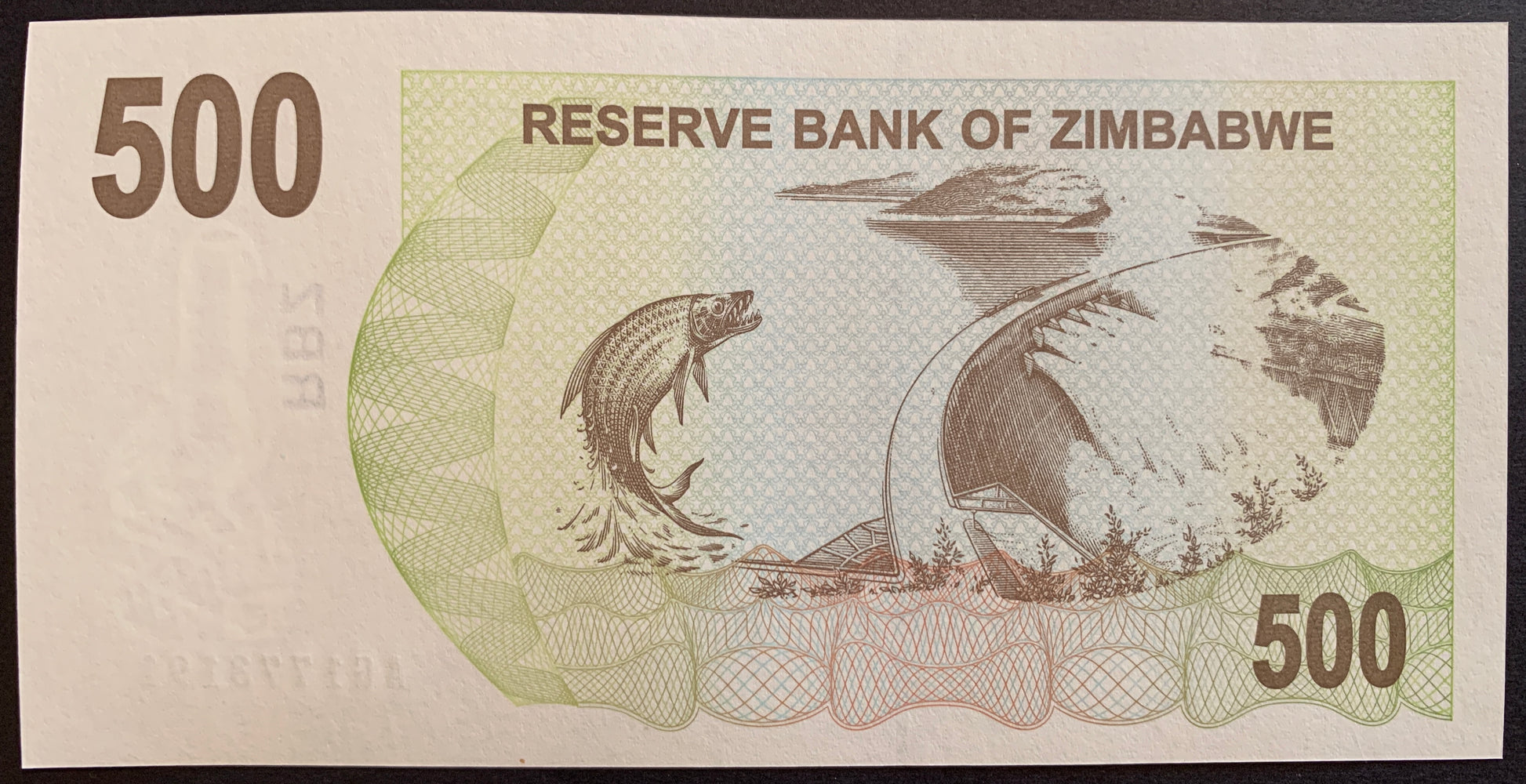 Zimbabwe 500 Dollars 2006 P-43 hyperinflationary bearers cheque with Tigerfish (Hydrocynus vittatus), and Kariba Dam on Zambezi River