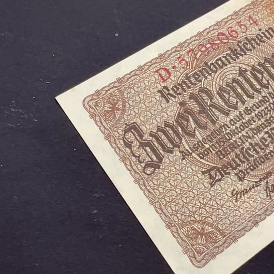 Front video footage of a crisp, vintage 1937 Germany 2 Rentenmark banknote featuring classic gothic typography and intricate geometric borders.
