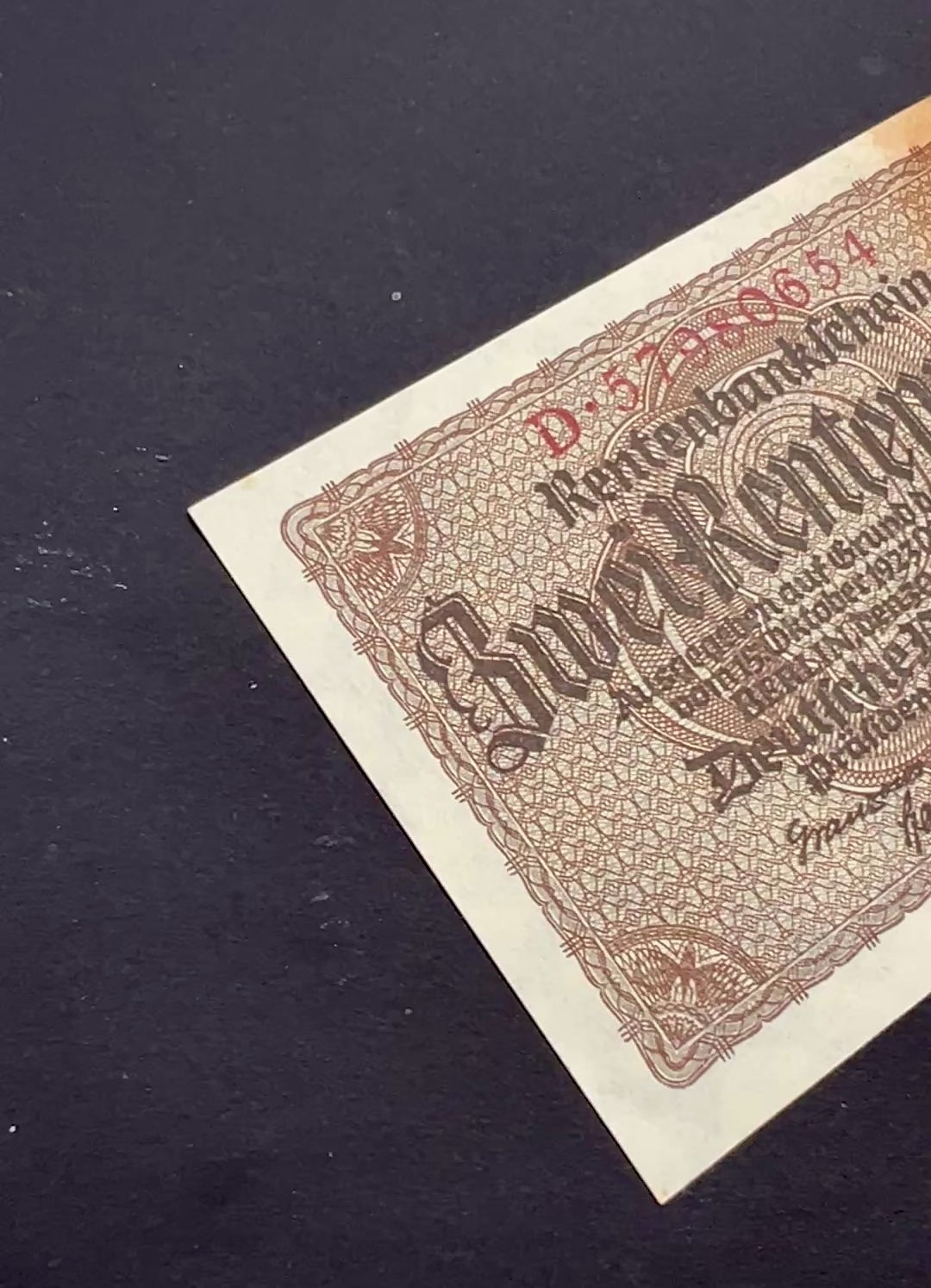 Front video footage of a crisp, vintage 1937 Germany 2 Rentenmark banknote featuring classic gothic typography and intricate geometric borders.
