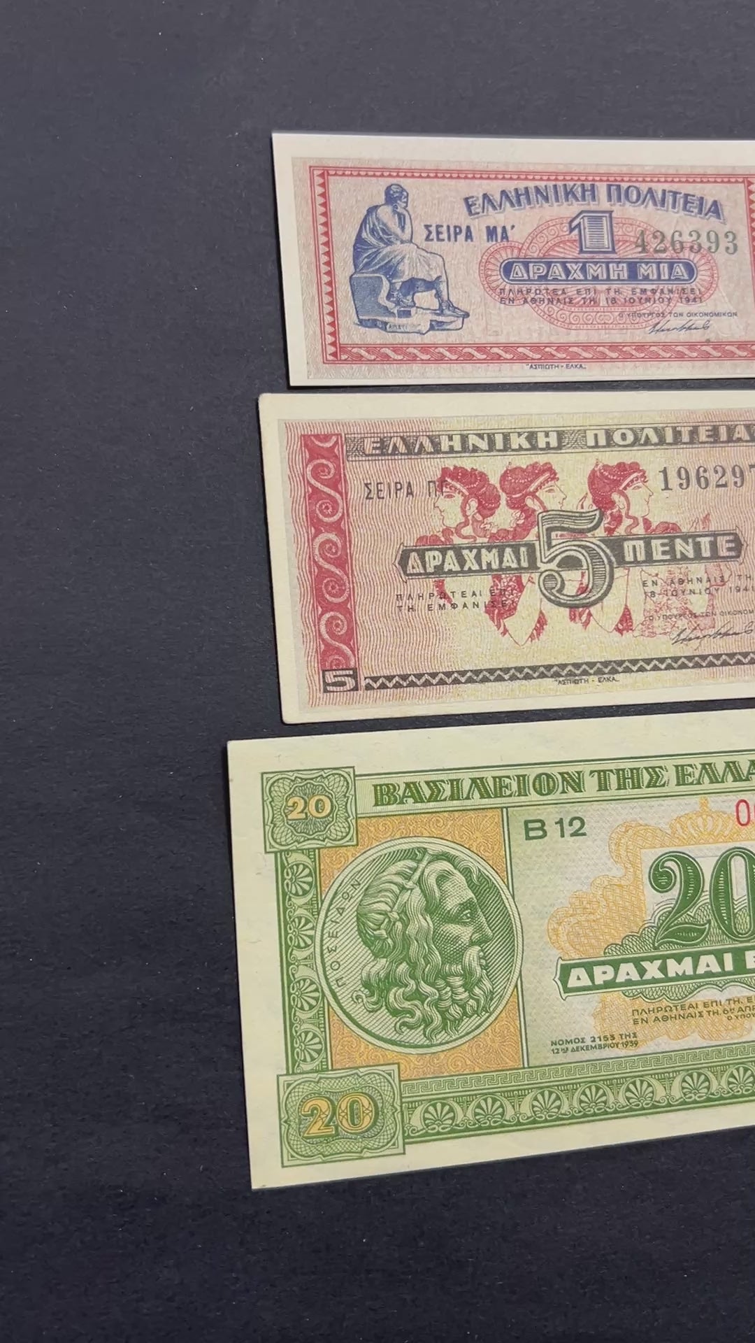 Front view of an uncirculated WWII era Greek banknote bundle featuring a 1941 1 Drachma, 1941 5 Drachmai, and 1940 20 Drachmai with classical art and Poseidon.
