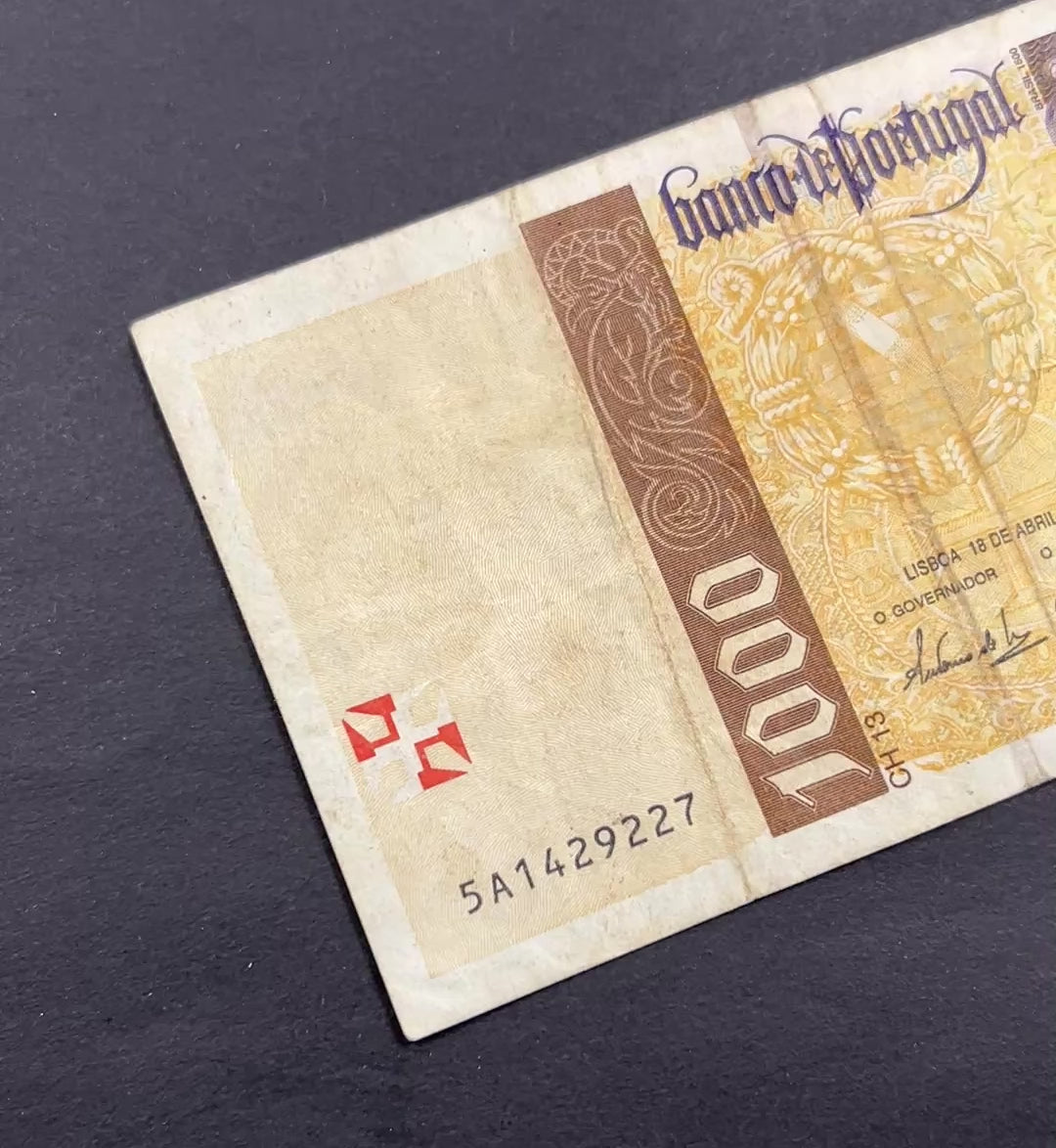 Front view of a circulated 1996 Portugal 1000 Escudos banknote featuring a portrait of explorer Pedro Alvares Cabral and the Cross of the Order of Christ.
