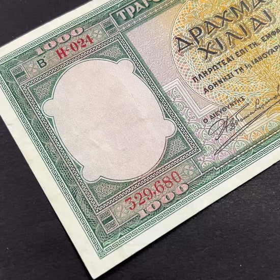 Front view of a vintage 1939 Greece 1000 Drachmai banknote featuring a portrait of a young Greek woman in traditional bridal attire and intricate guilloche patterns.