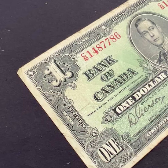Front view of a vintage 1937 Canada 1 Dollar banknote featuring a portrait of King George VI in military uniform.
