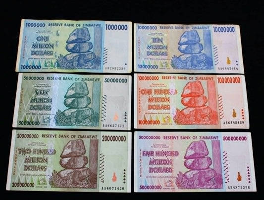 Set of Zimbabwean banknotes with varying denominations and colors.