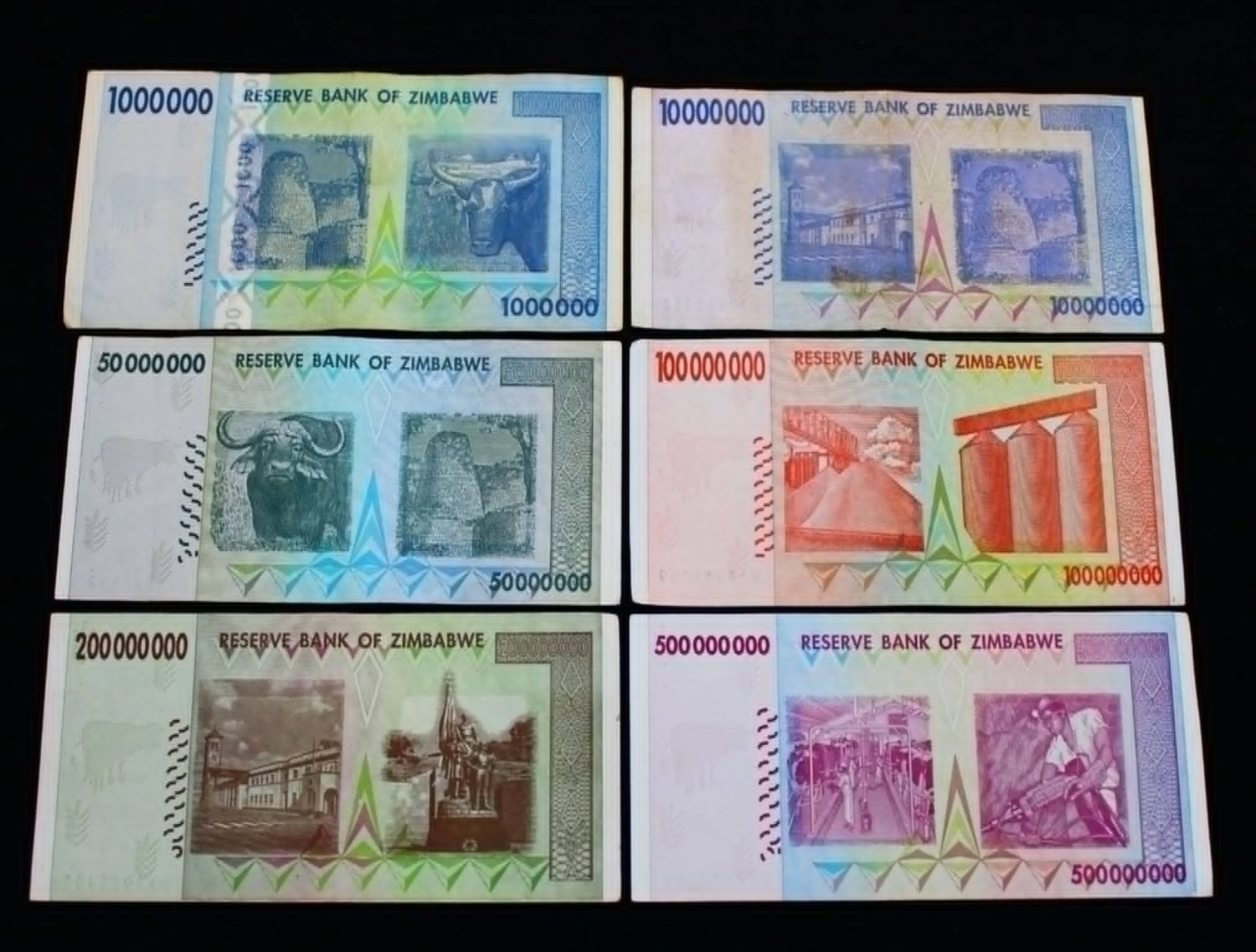 Collection of Zimbabwean banknotes with varying denominations and designs.